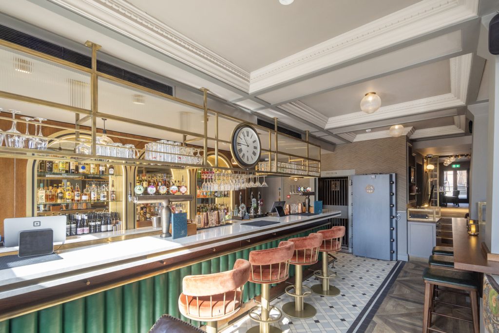 Bar area of Machine Inn Ashbourne with tellers chair inspired bar stools